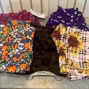 Five pairs of new Lulu Roe leggings. Never worn brand new. Size one size OS.Cute